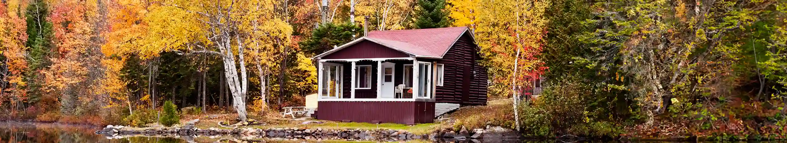 House on the bank of a lake in the woods